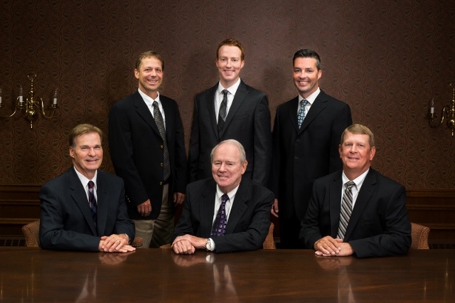 Image of the Board of Directors members sitting at a table